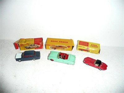 Lot 252 - Three Boxed Dinky Cars:- Packard Convertible No.132, in green with red interior and grey...