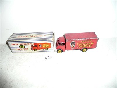 Lot 256 - A Boxed Dinky 'Golden Shred' Guy Van No.919, in red with yellow hubs and 'golly' design (playworn)