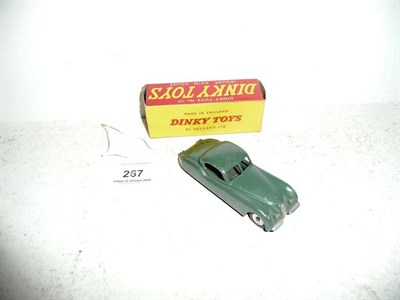 Lot 267 - A Boxed Dinky Jaguar XK120 Coupe No.157, in dark sage green , with spun hubs.