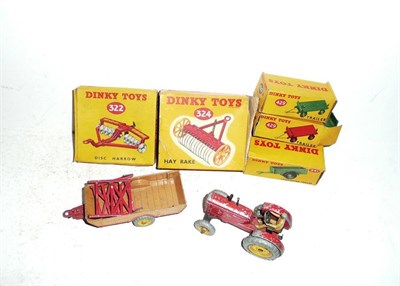 Lot 269 - A Boxed Playworn Dinky Massey-Harris Tractor No.300, together with two boxed implements -...