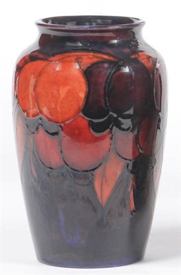 Lot 1586 - A William Moorcroft Flambe "Wisteria" Baluster Vase, on a deep purple ground, impressed factory...