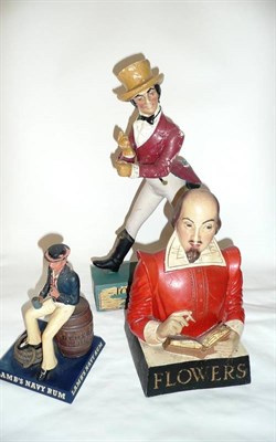 Lot 290 - Three Rubberoid Pub Advertising Figures:-  Lambs Navy Rum, in the form of a sailor seated on a...