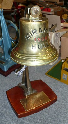 Lot 336 - A Brass Bell from The Trawler 'Miranda, Hull, 1906', with clapper and rope, mounted on a cast brass