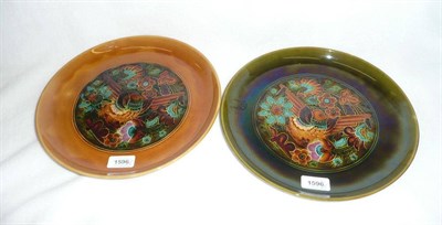 Lot 1596 - Two Linthorpe Pottery Circular Chargers, designed by Christopher Dresser, decorated with a stylised