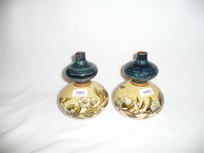 Lot 1597 - A Pair of Linthorpe Pottery Double Gourd Vases, shape No.141, designed by Christopher Dresser,...