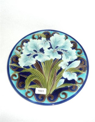 Lot 1601 - A Burmantofts Faience Pottery Charger, decorated with blue iris, in tones of blue, green and brown