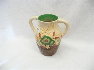 Lot 1603 - A Clarice Cliff  "Cabbage Flower" Twin-Handled Lotus Jug, in tones of green, brown, red and orange