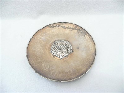 Lot 1611 - An Omar Ramsden Silver Dish, maker's mark OR, London 1925, the centre cast with a thistle,...