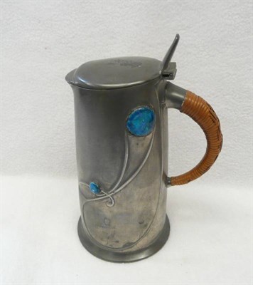 Lot 1614 - A Liberty & Co "Tudric" Pewter and Enamel Hotwater Jug and Cover, with stylised decoration and...