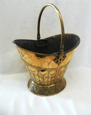 Lot 1623 - An Arts and Crafts Brass Helmet Shaped Coal Bucket, made by Richard Perry, Son & Co.,...