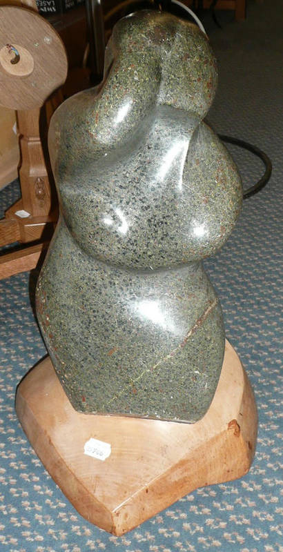 Lot 1624 - A 20th Century Granite Sculpture, modelled as a stylised figure with arm over head and other...