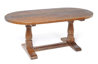 Lot 1631 - A Robert "Mouseman" Thompson Oak Shaped Table, 1636, with semi-circular ends, adzed all over...