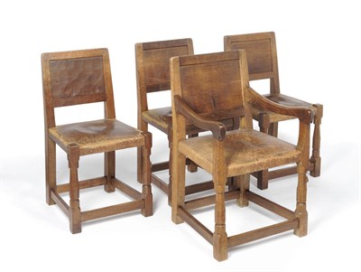 Lot 1632 - A Set of Four (3+1) Robert "Mouseman" Thompson Oak Panel Back Chairs, adzed all over, on...