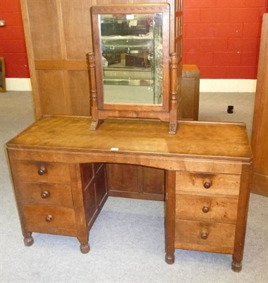 Lot 1636 - A Robert "Mouseman" Thompson Panelled Oak Kneehole Dressing Table, with raised upstand above...