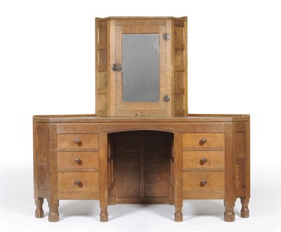 Lot 1640 - A Robert "Mouseman" Thompson Panelled Oak Corner Dressing Table, the upper section with...