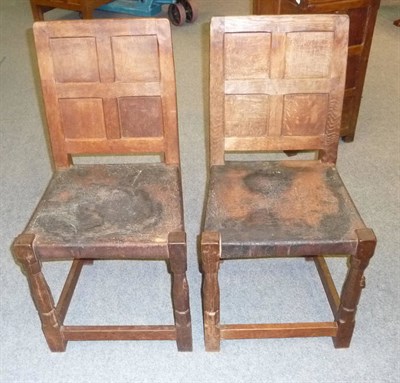 Lot 1644 - A Pair of Robert "Mouseman" Thompson Bedroom Chairs, with four panel backs, on two octagonal...