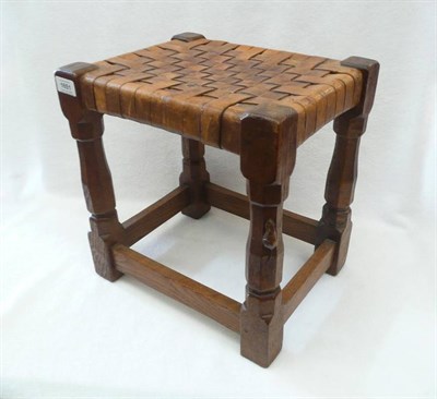 Lot 1651 - A Robert "Mouseman" Thompson Oak Stool, with interwoven seat, on four octagonal legs joined by...