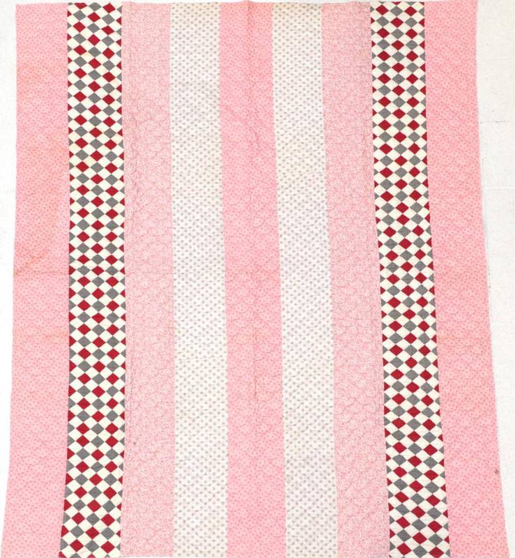 Lot 2015 - Large 19th Century Strippy Patchwork Quilt, in pink and purple sprigged cottons amongst two lengths