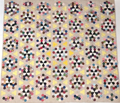 Lot 2016 - 19th Century Large Silk Patchwork Quilt, designed with hexagonal shaped patches in clusters...