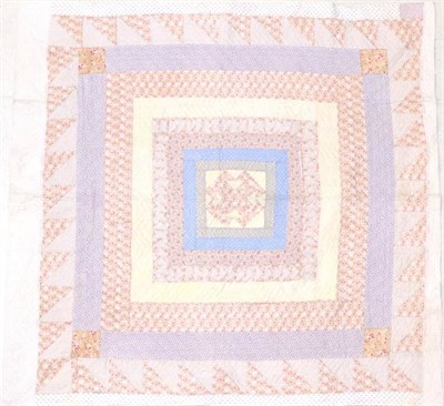 Lot 2018A - Late 19th Century Quilt, with a central geometric design surrounded by frames of floral...