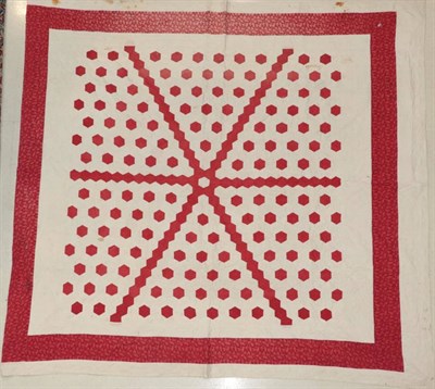 Lot 2020 - A Large Red and White Quilted Cover, with red hexagonal patches within in six segments,...