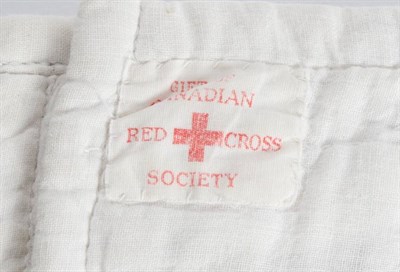 Lot 2025 - A Circa 1940s Canadian Red Cross Quilt, made in blocks of pink cotton, each cornered with...