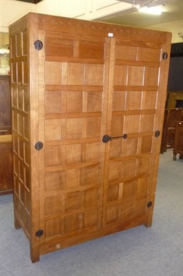 Lot 1654 - A Robert "Mouseman" Thompson Oak Panelled Hall Wardrobe, with half penny moulding above two...