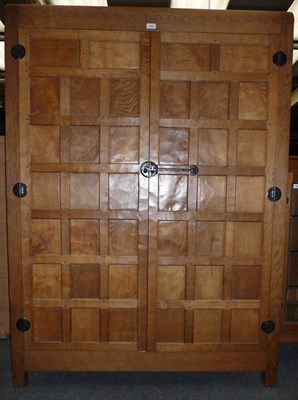 Lot 1655 - A Robert "Mouseman" Thompson Oak Panelled Wardrobe, with half penny moulding above two doors...