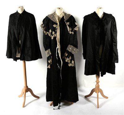 Lot 2092 - Late Victorian Black Silk Costumes, including a full length day robe with cream lace mount to...