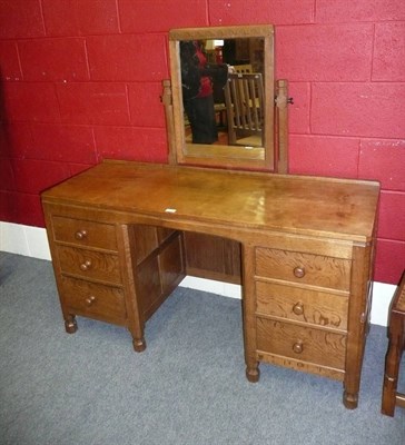 Lot 1656 - A Robert "Mouseman" Thompson Oak Panelled Dressing Table, with rectangular fixed central...