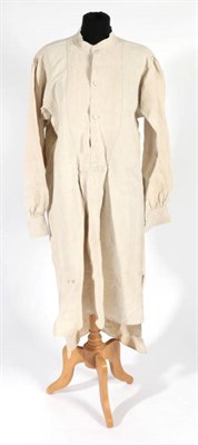 Lot 2096 - A Late 19th Century/Early 20th Century French Farm Workers Long Smock, in natural linen, button...