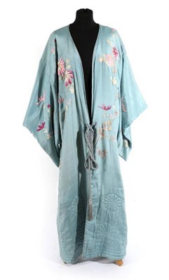Lot 2099 - Early 20th Century Pale Blue Silk Embroidered and Quilted Kimono, decorated overall with pink...