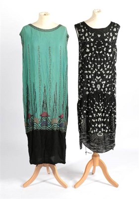 Lot 2104 - Circa 1920s Green and Black Crepe Beaded Shift Dress, the mid lower densely beaded in blue,...