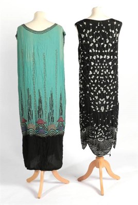 Lot 2104 - Circa 1920s Green and Black Crepe Beaded Shift Dress, the mid lower densely beaded in blue,...
