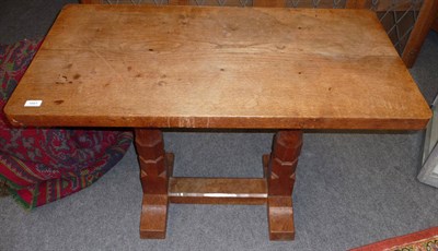 Lot 1661 - A Robert "Mouseman" Thompson Oak Extension Table, on two octagonal legs joined by a single...