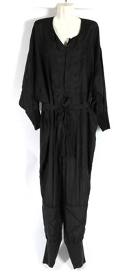 Lot 2157 - Katharine Hamnett London Black Silk Jumpsuit, with buttons to the front, long sleeves, quilted...