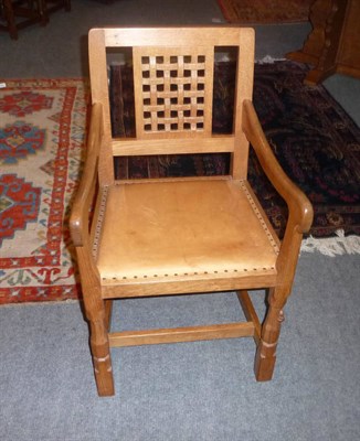 Lot 1664 - A Robert "Mouseman" Thompson Oak Armchair, with lattice back on octagonal front legs with...