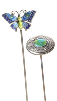 Lot 2184 - A Charles Horner Hinged Silver and Enamel Butterfly Hat Pin, decorated in green and blue,...