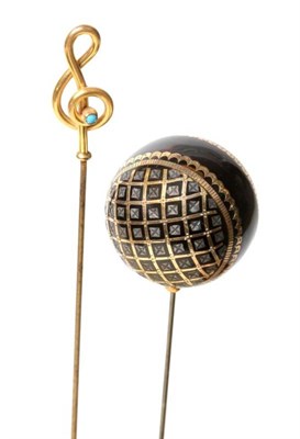 Lot 2186 - A Tortoiseshell Gold and Silver Pique Work Spherical Hat Pin, 3cm; and a 9ct Gold Treble Clef...