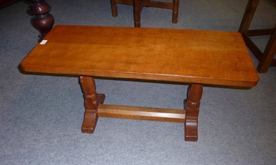 Lot 1676 - A Robert "Mouseman" Thompson Oak Rectangular Coffee Table, on two octagonal legs joined by a...