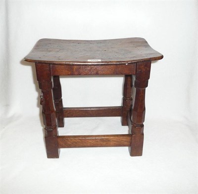 Lot 1680 - A Robert "Mouseman" Thompson Burr Oak Stool, on four octagonal legs joined by a stretcher at...