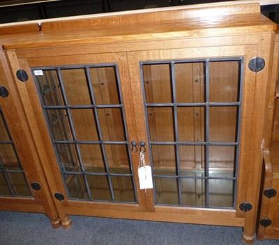 Lot 1683 - A Robert "Mouseman" Thompson Oak Display Cabinet, with raised upstand, above two leaded glazed...