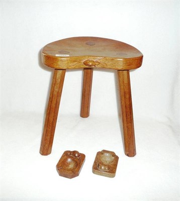 Lot 1685 - A Robert "Mouseman" Thompson Oak Calf Kidney Stool, on three octagonal legs, with carved mouse...