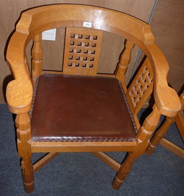 Lot 1692 - A Robert "Mouseman" Thompson Oak Monks Chair, with curved back and shaped arms over three...