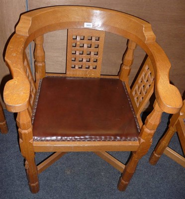 Lot 1693 - A Robert "Mouseman" Thompson Oak Monks Chair, with curved back and shaped arms over three...