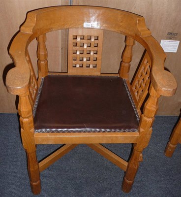 Lot 1694 - A Robert "Mouseman" Thompson Oak Monks Chair, with curved back and shaped arms over three...