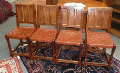 Lot 1709 - A Set of Four Sid Pollard Oak Panel Back Dining Chairs, with woven leather seats, on turned...