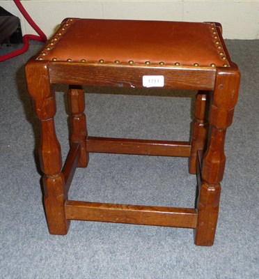 Lot 1711 - A Sid Pollard Oak Dressing Table Stool, on four octagonal legs joined together by four low...