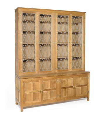 Lot 1712 - An Albert "Eagleman" Jefferies Oak Glazed Bookcase, the upper section with four leaded glass...