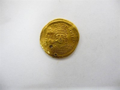 Lot 10 - Byzantine Gold Solidus of Justin II (565-5789AD), 4.45g, rev. Constantinople seated holding...